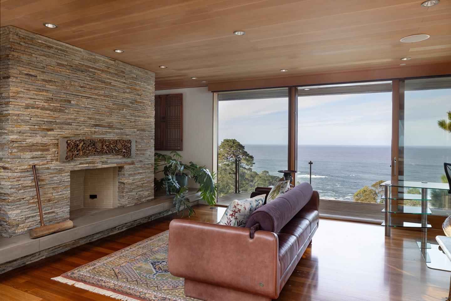 140 Boyd Way Carmel, CA 93923 - Photo 15 of 40 a living room with furniture large windows and a fireplace