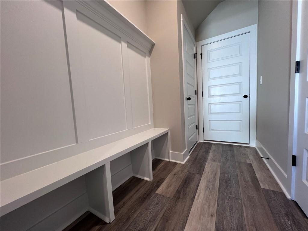 23 Rock Pk Way, Unit 26 Tucker, GA 30084 - Photo 14 of 28 a room with walk in closet and wooden floor