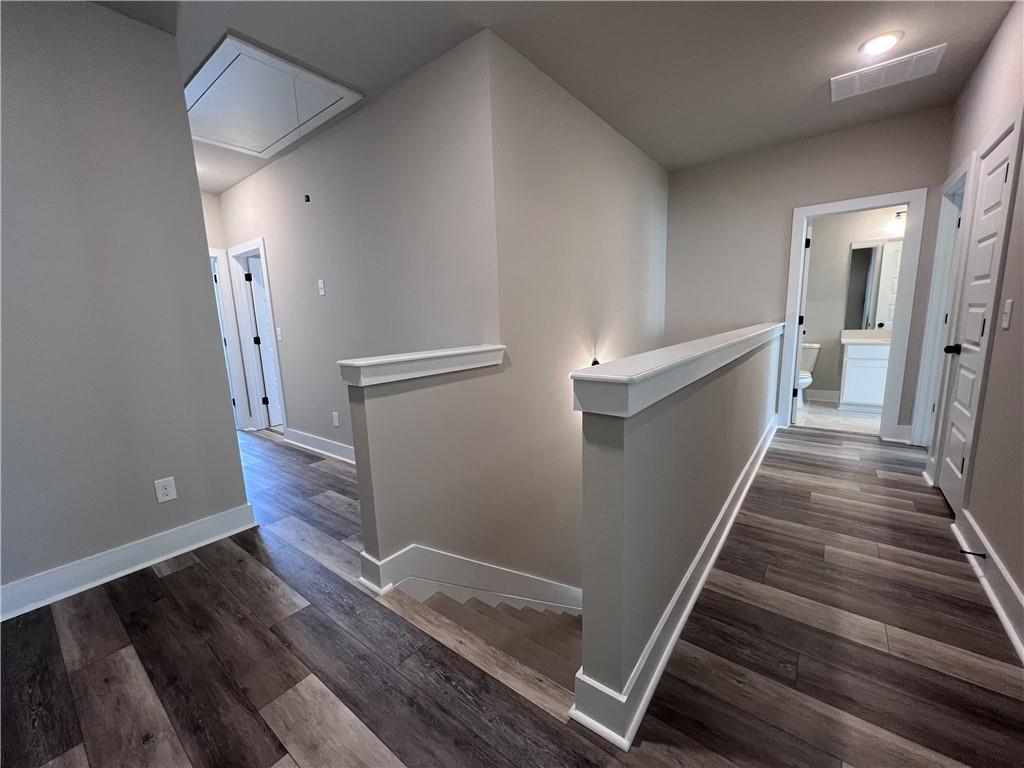 23 Rock Pk Way, Unit 26 Tucker, GA 30084 - Photo 19 of 28 a view of a hallway with wooden floor and staircase