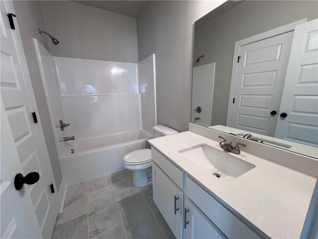 23 Rock Pk Way, Unit 26 Tucker, GA 30084 - Photo 20 of 28 a bathroom with a sink toilet tub and shower