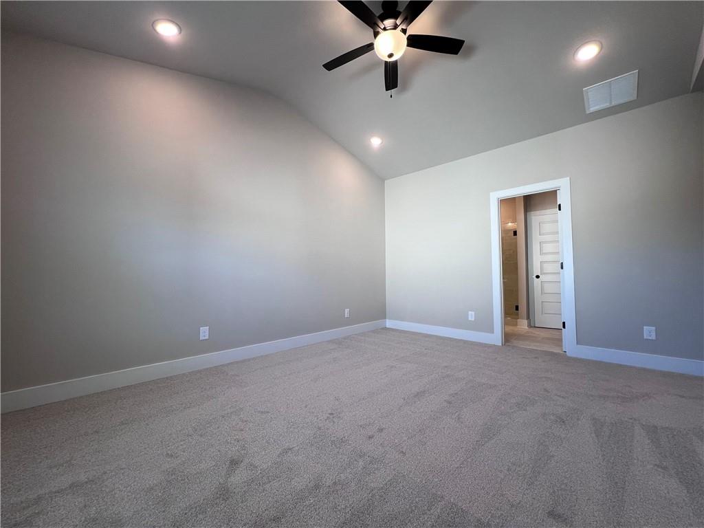 23 Rock Pk Way, Unit 26 Tucker, GA 30084 - Photo 22 of 28 an empty room with a ceiling fan and carpet