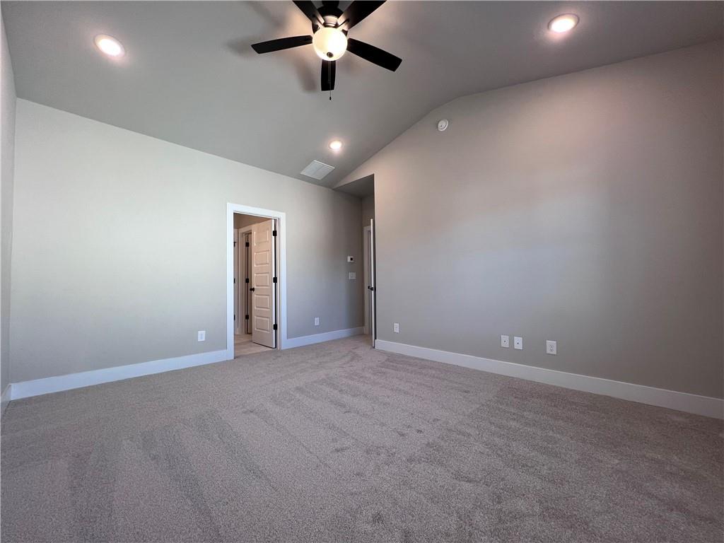 23 Rock Pk Way, Unit 26 Tucker, GA 30084 - Photo 23 of 28 en empty room with ceiling fan and window