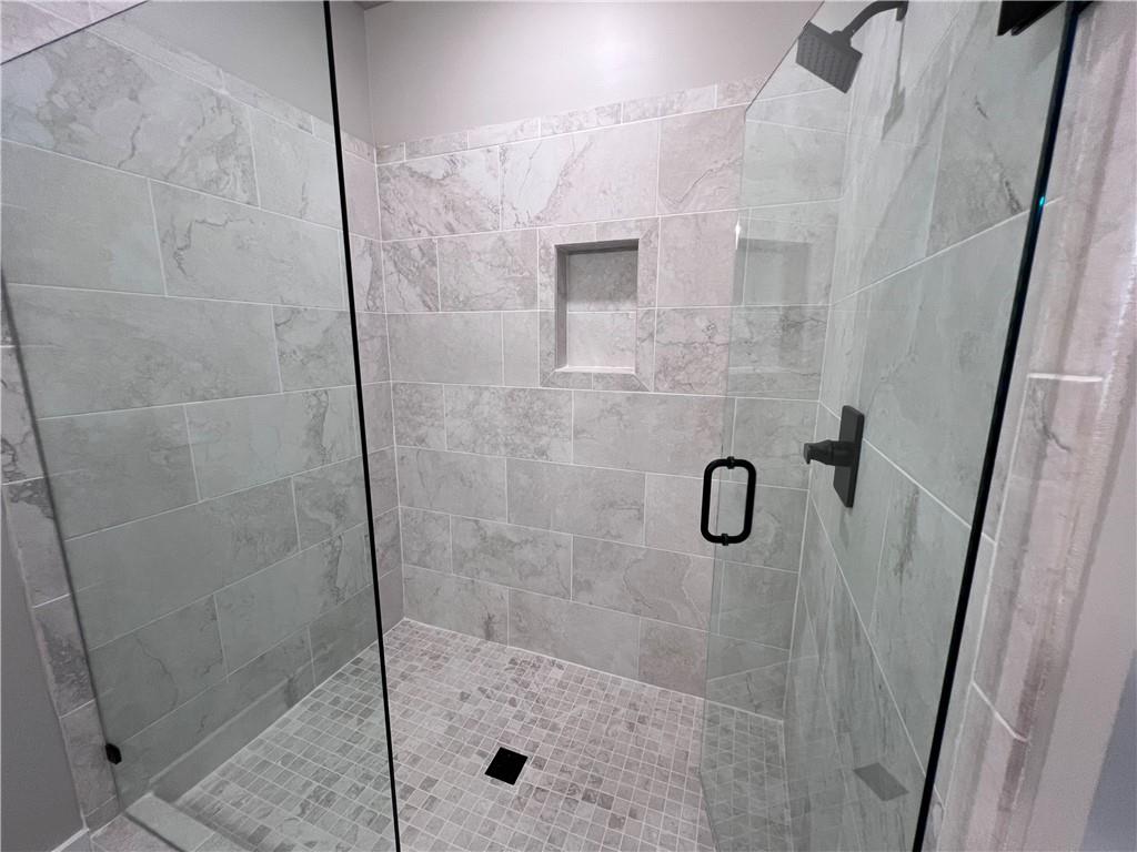 23 Rock Pk Way, Unit 26 Tucker, GA 30084 - Photo 27 of 28 a bathroom with a shower