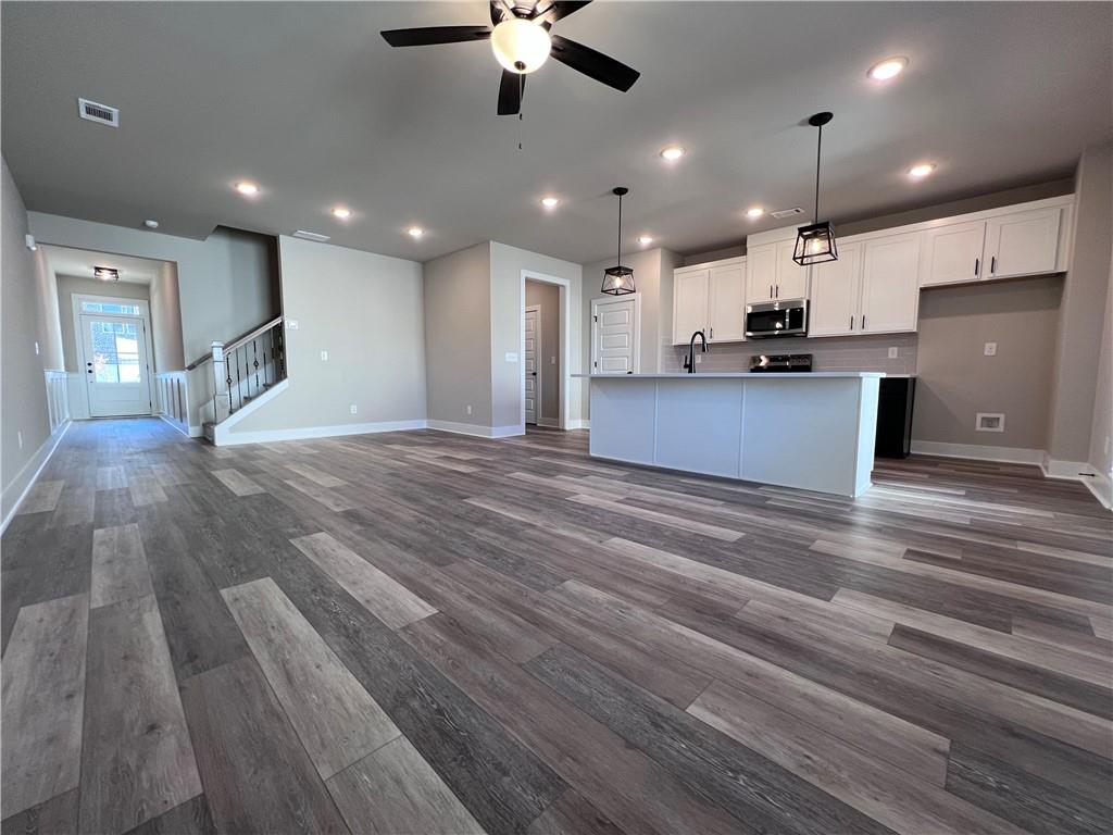 23 Rock Pk Way, Unit 26 Tucker, GA 30084 - Photo 9 of 28 a view of kitchen with refrigerator microwave and stove