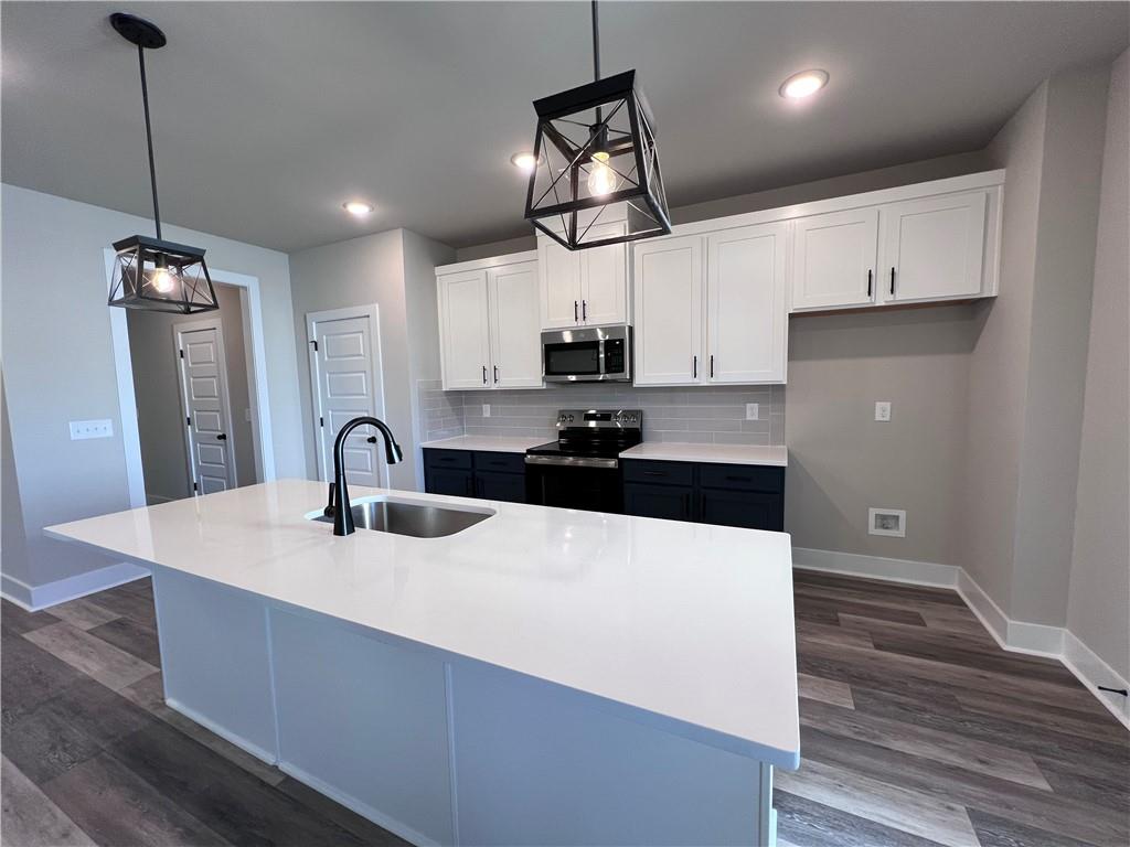 23 Rock Pk Way, Unit 26 Tucker, GA 30084 - Photo 10 of 28 a kitchen with stainless steel appliances a sink stove and refrigerator