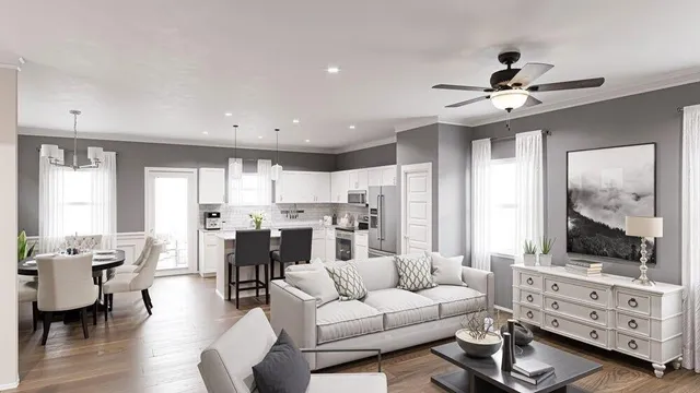 a living room with furniture kitchen view and a window