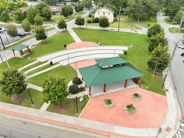 an outdoor space with furniture and garden