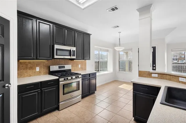 a view of room with a ceiling fan
