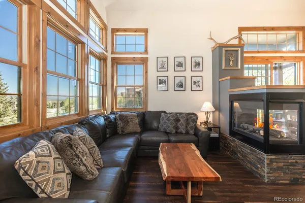 a living room with furniture fireplace and a flat screen tv
