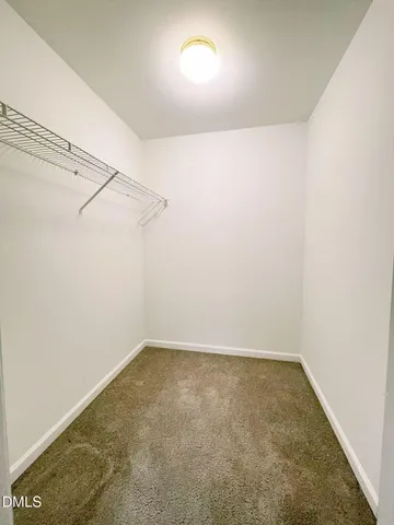 an empty room with a fan