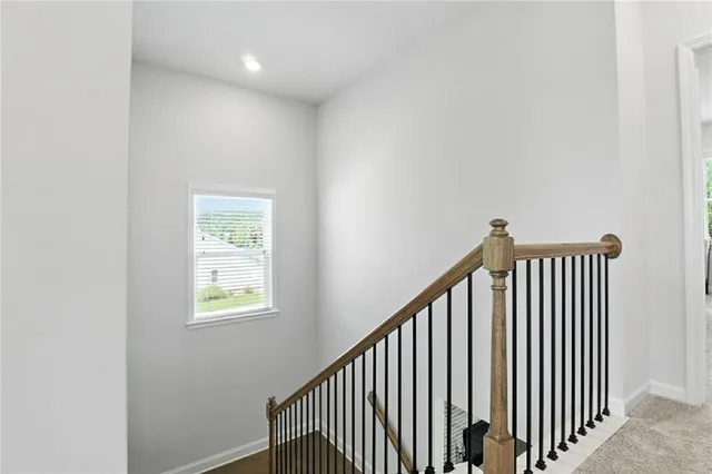 a view of a hallway with windows