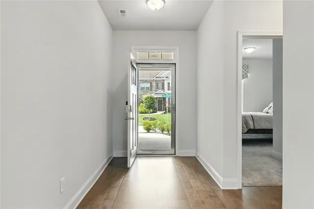 a view of a bedroom from a corridor