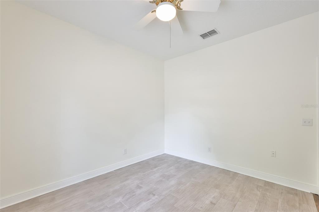 708 Coade Stone Drive Seffner, FL 33584 - Photo 26 of 48 a view of a small space with a fan