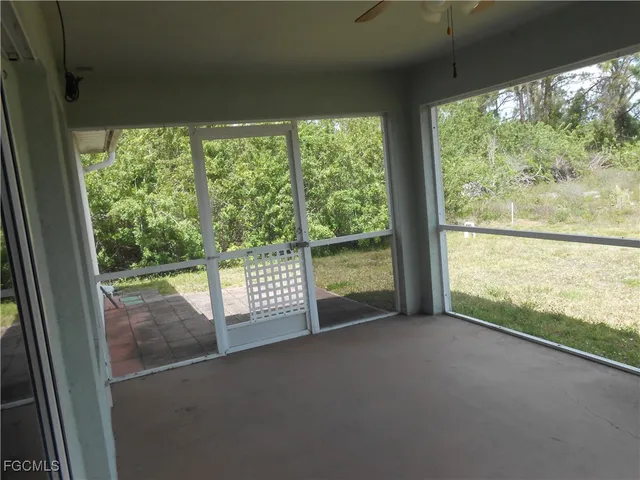 a view of a room with a large window