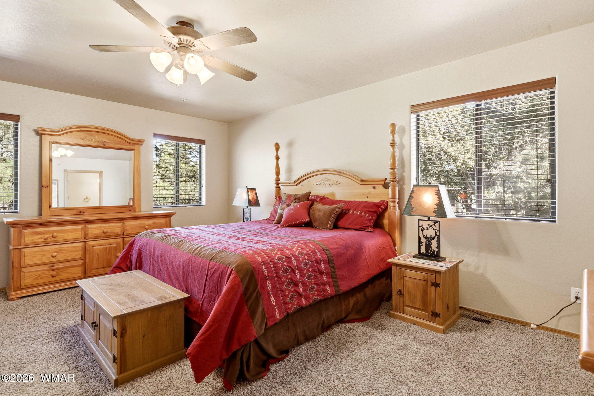 2877 Wahoo Road Overgaard, AZ 85933 - Photo 17 of 42 a bedroom with a bed and a dresser