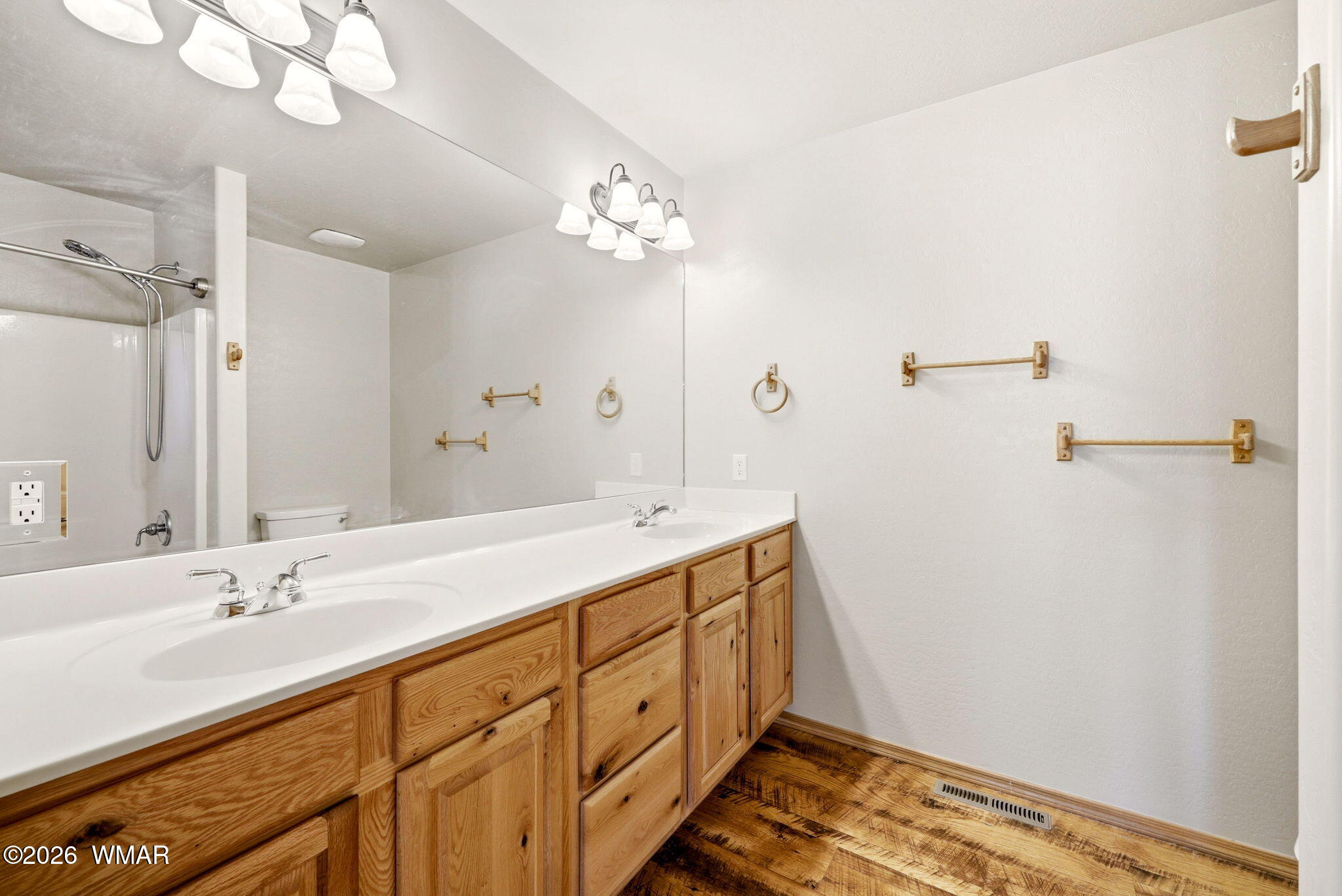 2877 Wahoo Road Overgaard, AZ 85933 - Photo 19 of 42 a bathroom with a double vanity sink and a mirror