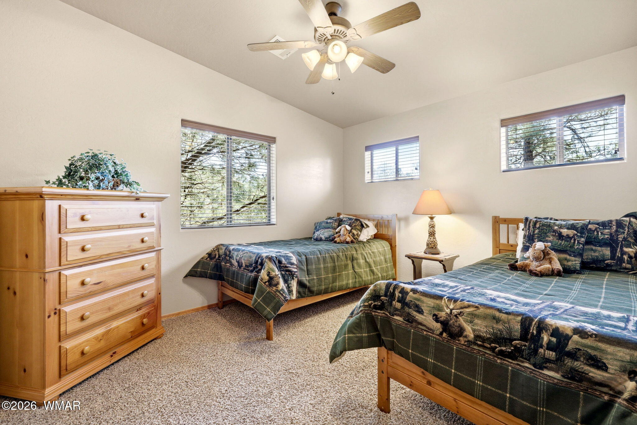 2877 Wahoo Road Overgaard, AZ 85933 - Photo 23 of 42 a bedroom with a bed and a window