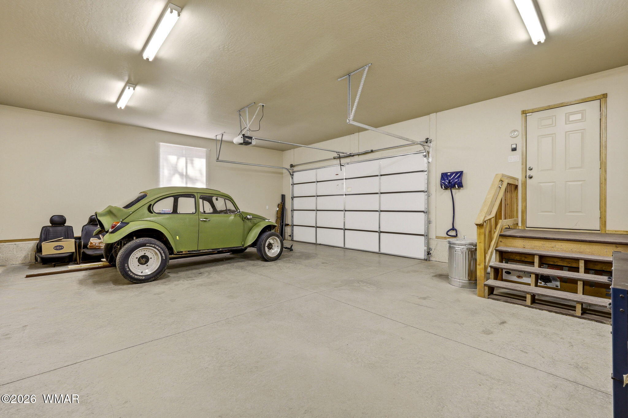 2877 Wahoo Road Overgaard, AZ 85933 - Photo 26 of 42 a view of a garage with parked cars