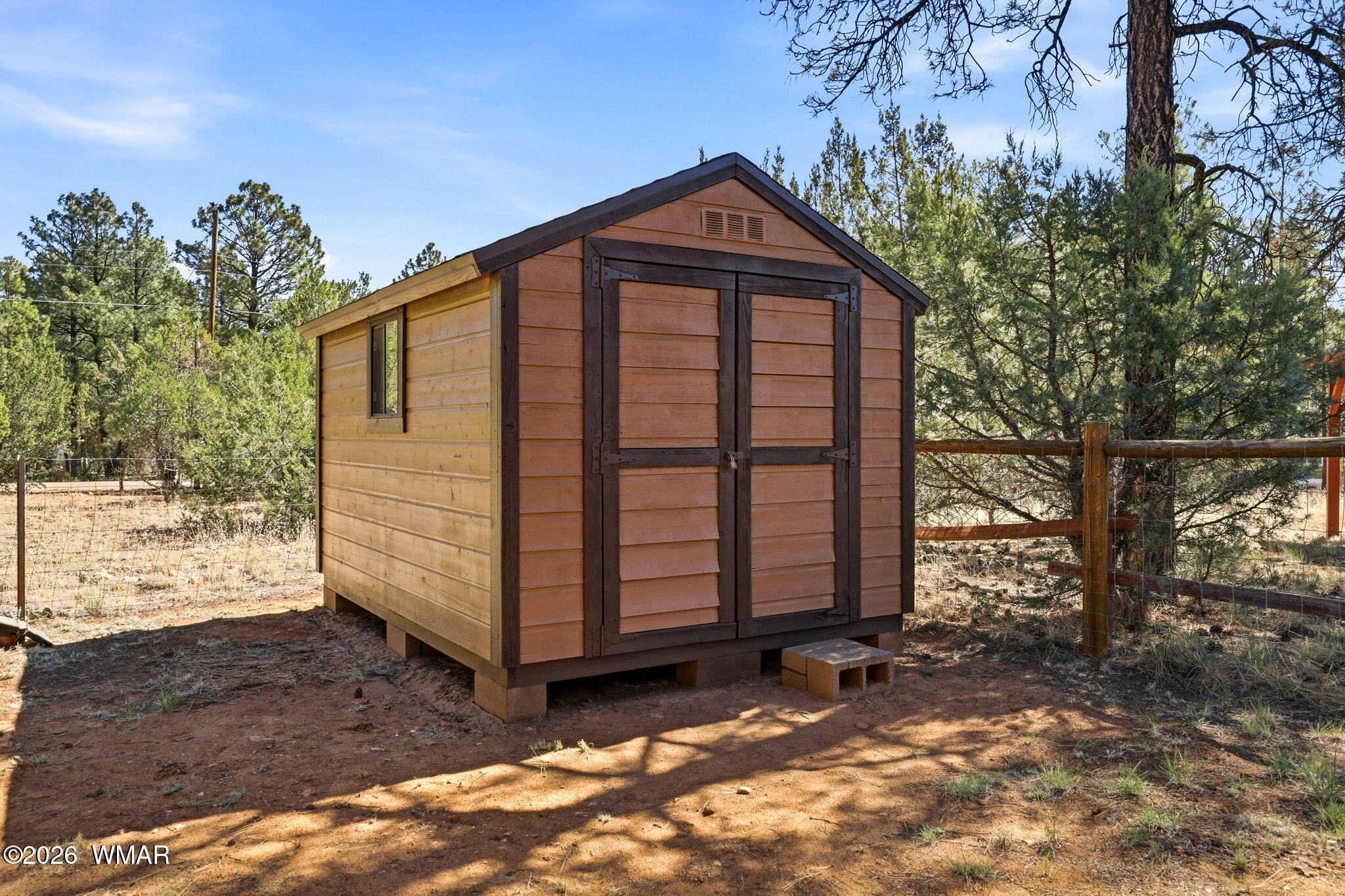 2877 Wahoo Road Overgaard, AZ 85933 - Photo 27 of 42 a front view of a house with a yard