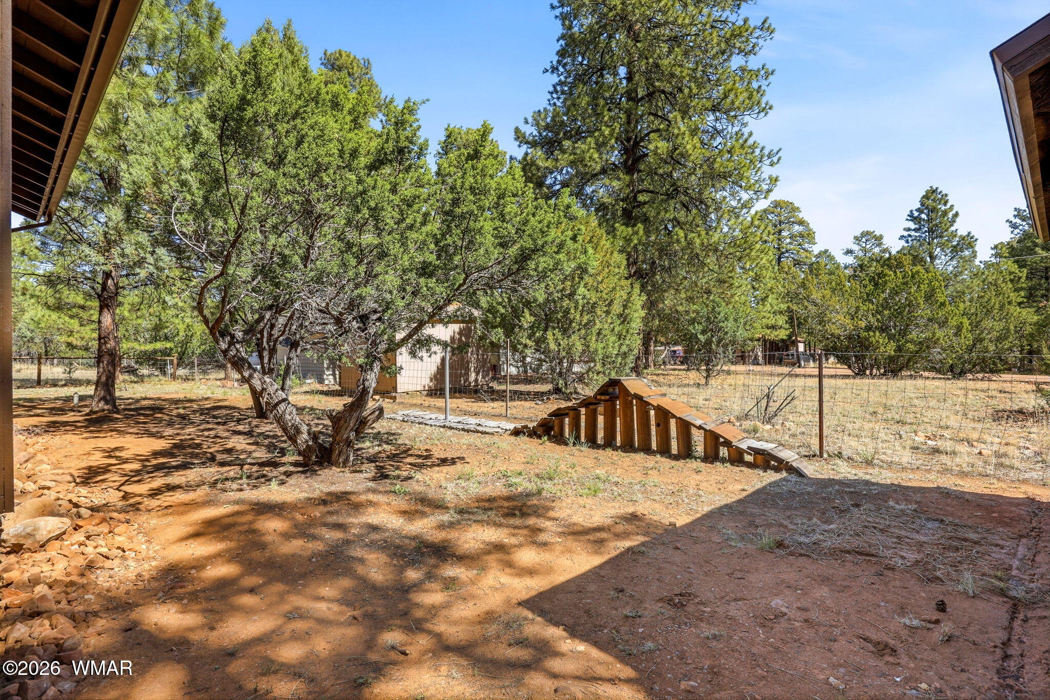 2877 Wahoo Road Overgaard, AZ 85933 - Photo 28 of 42 a view of a house with snow on the road