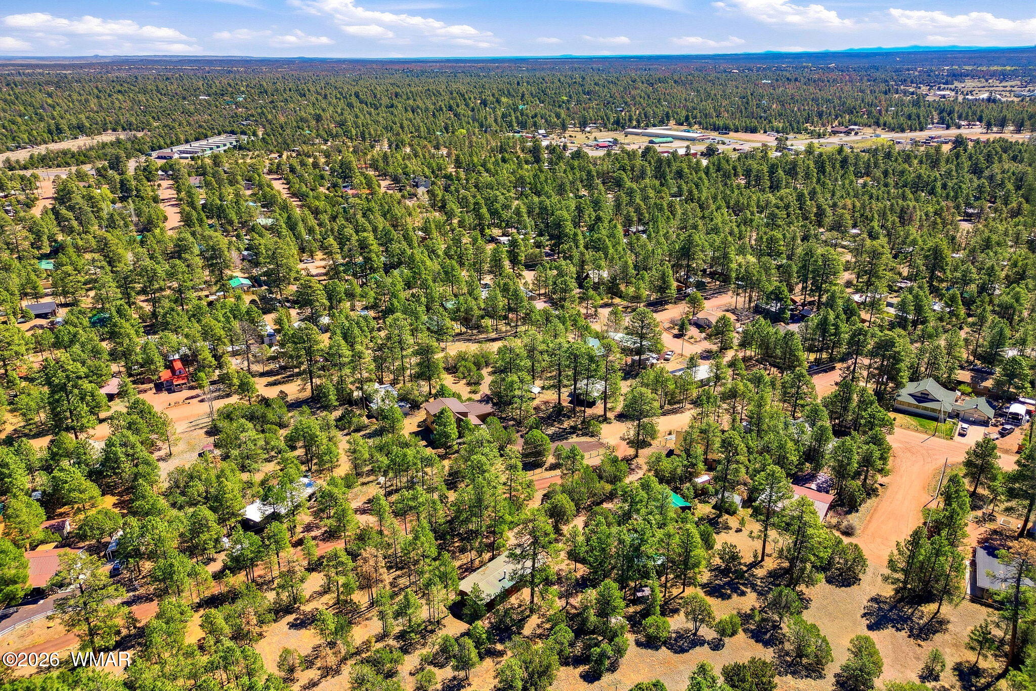 2877 Wahoo Road Overgaard, AZ 85933 - Photo 32 of 42 a view of a city with lush green forest