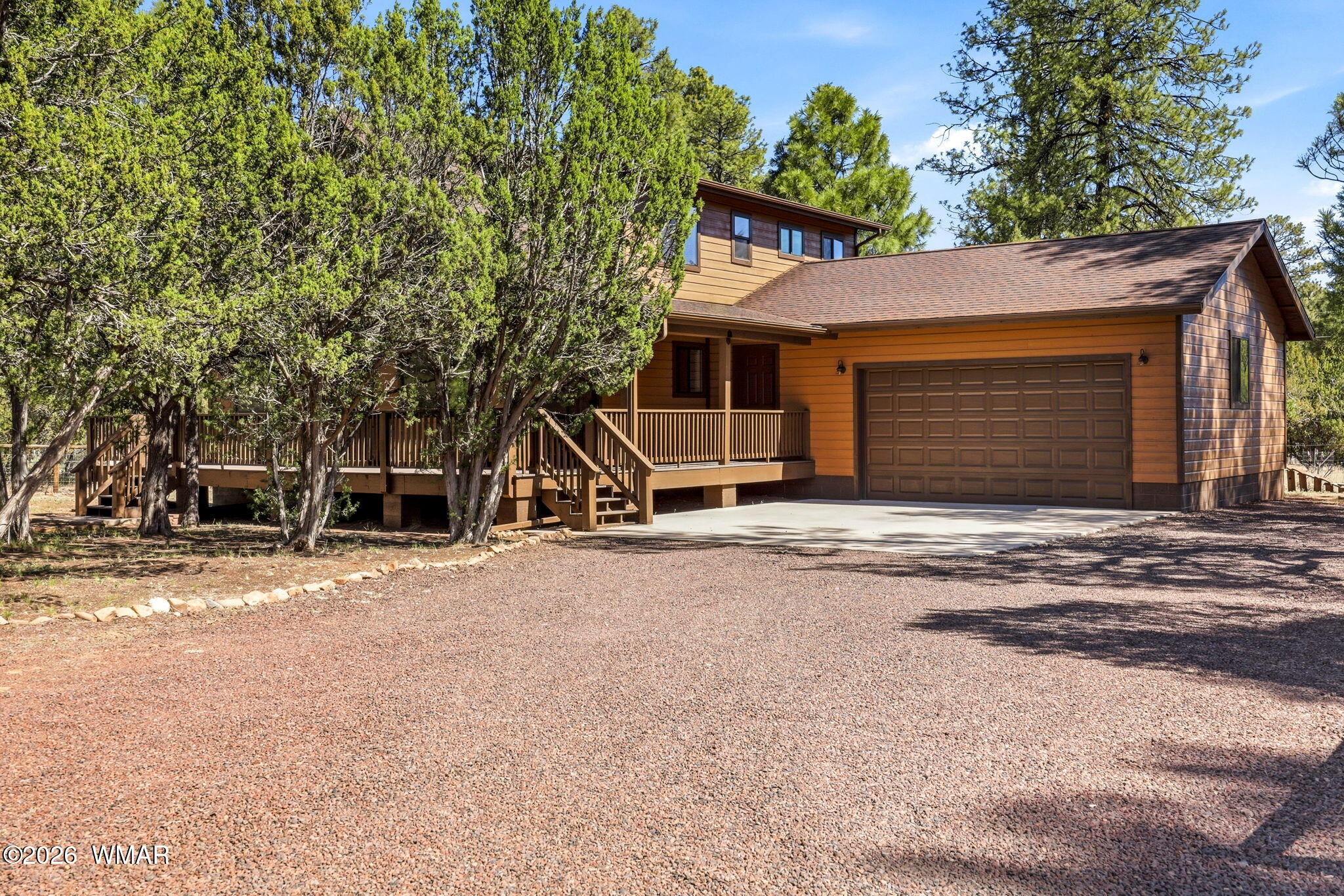 2877 Wahoo Road Overgaard, AZ 85933 - Photo 4 of 42 a view of a house with a yard