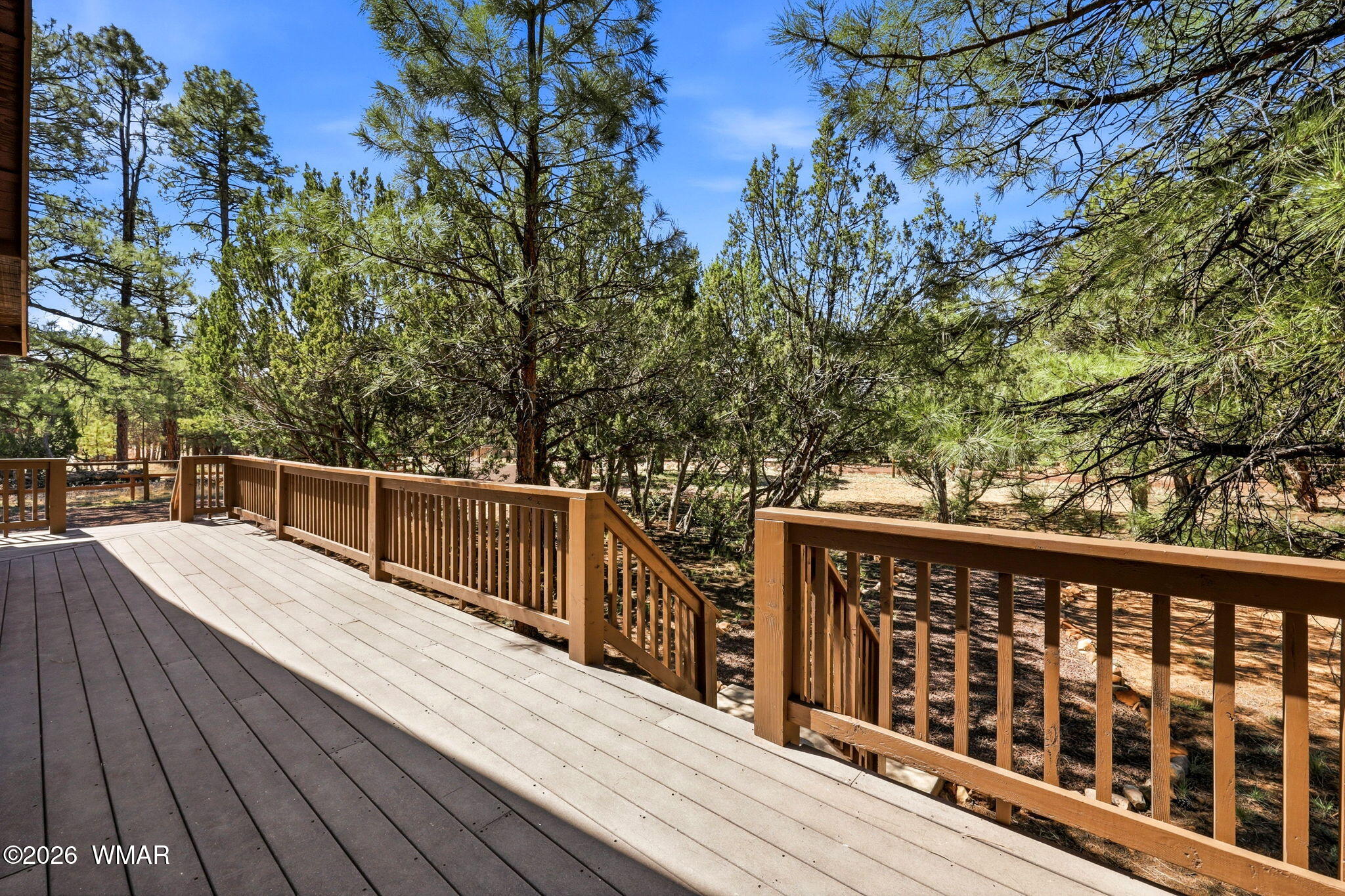 2877 Wahoo Road Overgaard, AZ 85933 - Photo 6 of 42 a view of balcony with wooden floor and fence