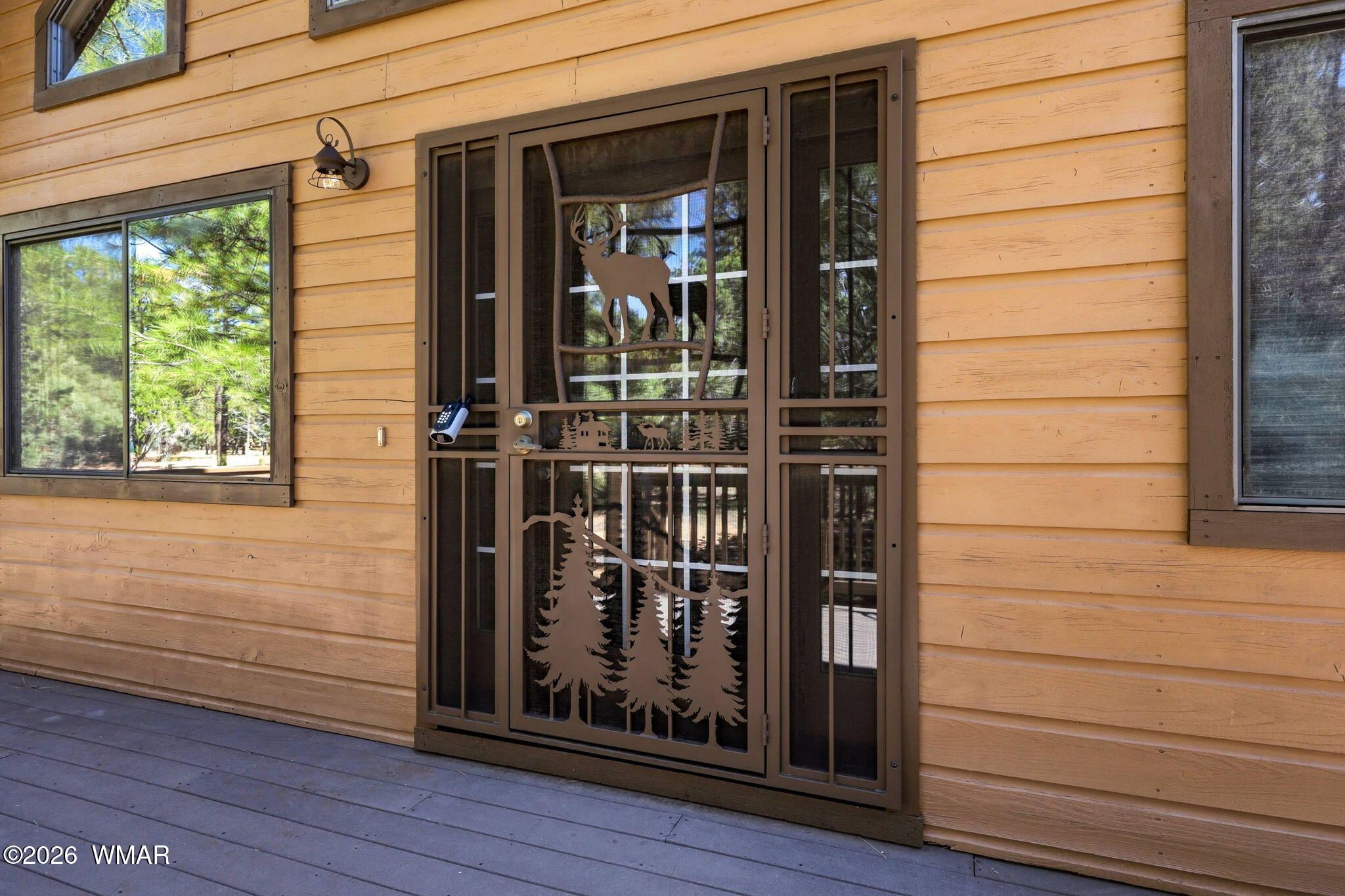 2877 Wahoo Road Overgaard, AZ 85933 - Photo 7 of 42 a view of front door of house and window