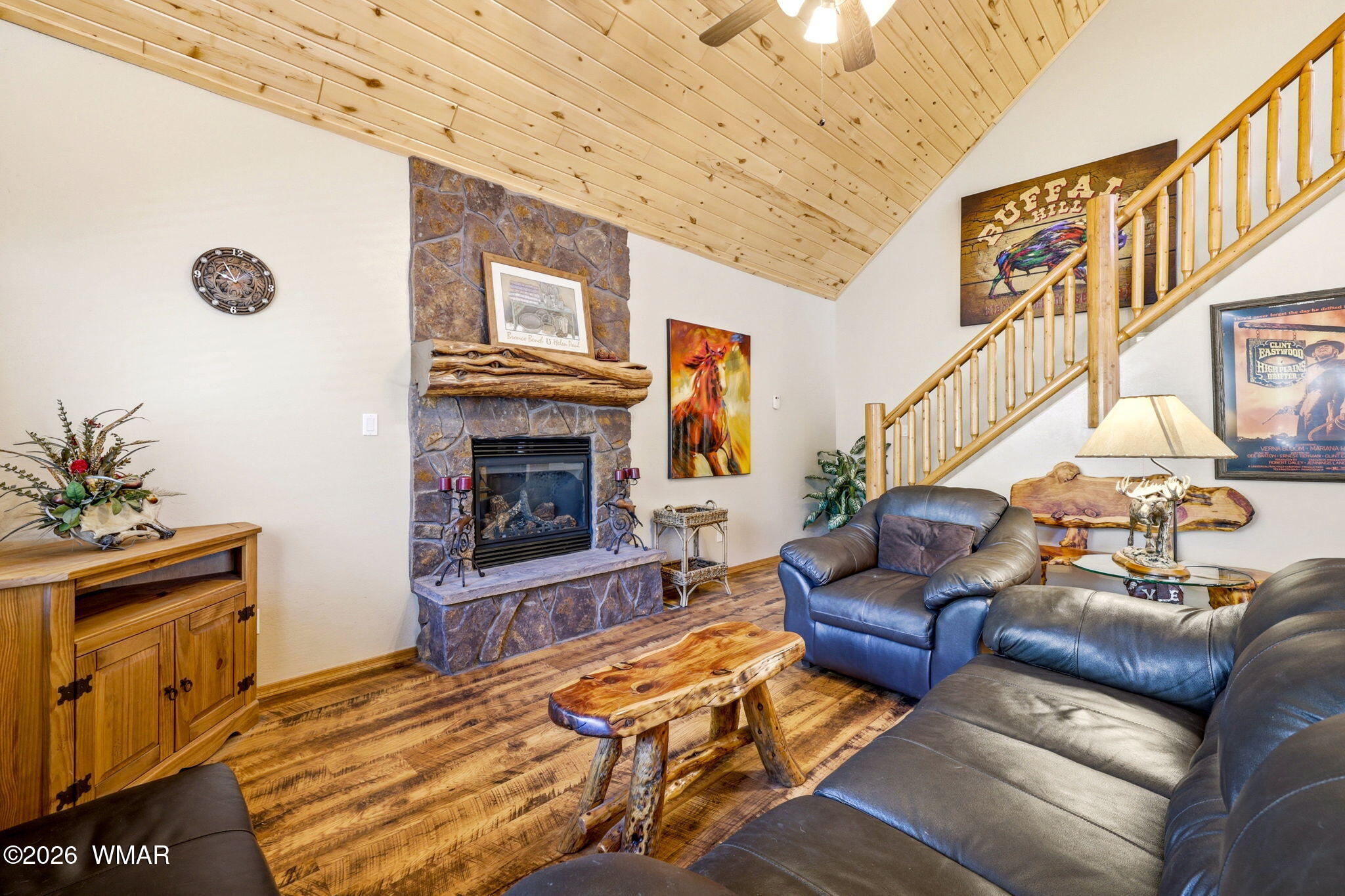 2877 Wahoo Road Overgaard, AZ 85933 - Photo 8 of 42 a living room with furniture a fireplace and a chandelier