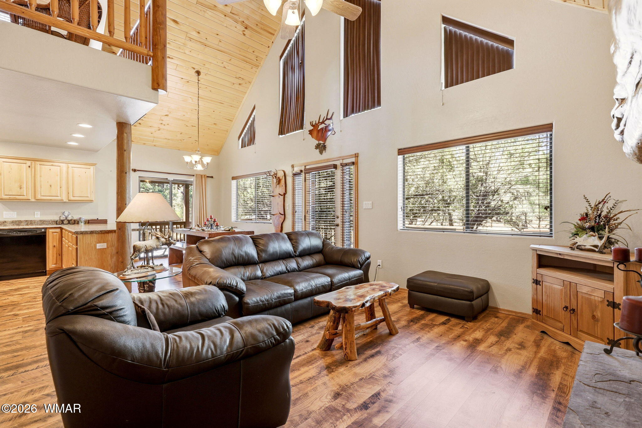 2877 Wahoo Road Overgaard, AZ 85933 - Photo 9 of 42 a living room with furniture a kitchen view and a large window