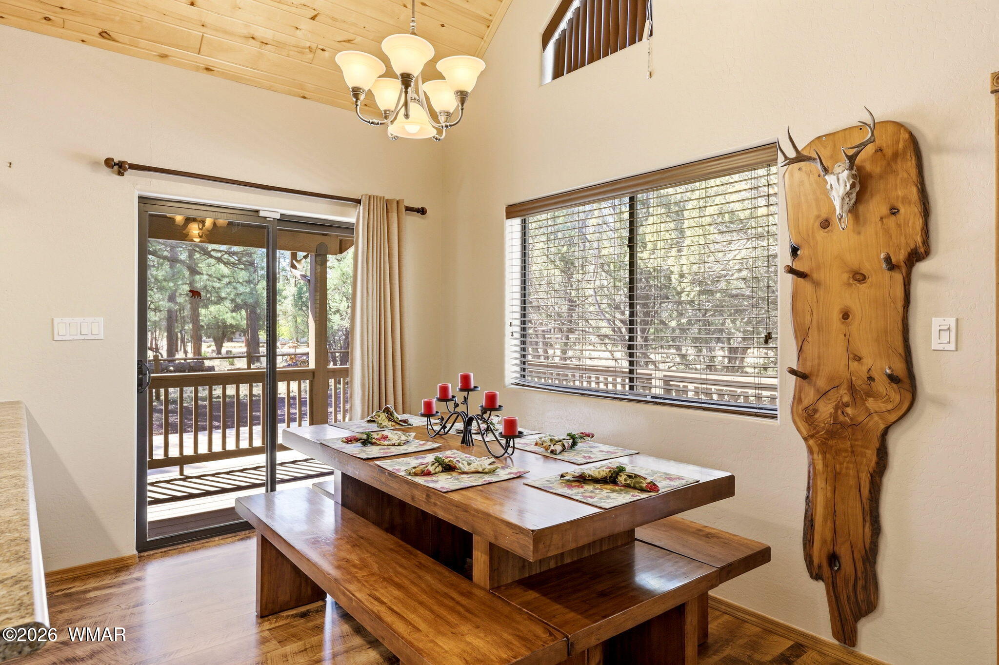2877 Wahoo Road Overgaard, AZ 85933 - Photo 10 of 42 a view of a dining room with furniture wooden floor and chandelier