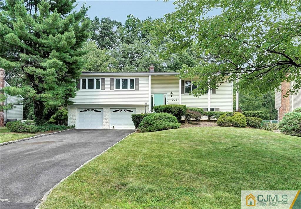 203 Riverbend Road Berkeley Heights, NJ 07922 - Photo 1 of 42 a view of a house with backyard and garden