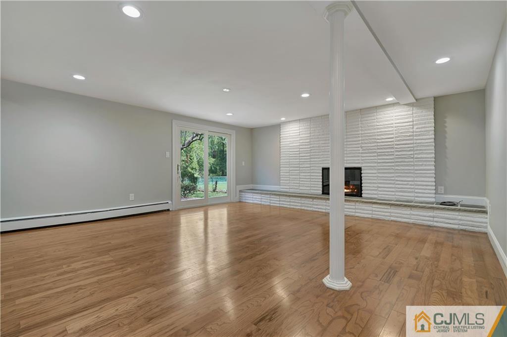 203 Riverbend Road Berkeley Heights, NJ 07922 - Photo 3 of 42 a view of empty room with wooden floor