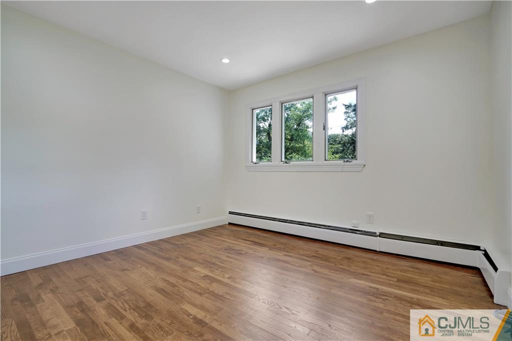 203 Riverbend Road Berkeley Heights, NJ 07922 - Photo 30 of 42 an empty room with a window