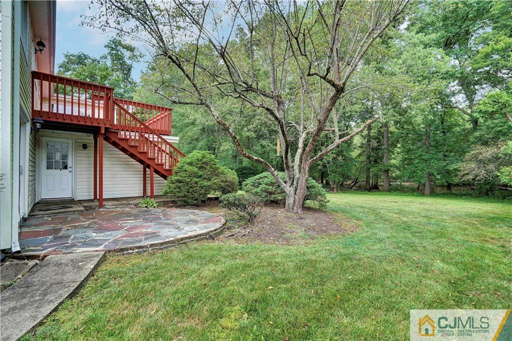 203 Riverbend Road Berkeley Heights, NJ 07922 - Photo 34 of 42 a view of a house with a yard