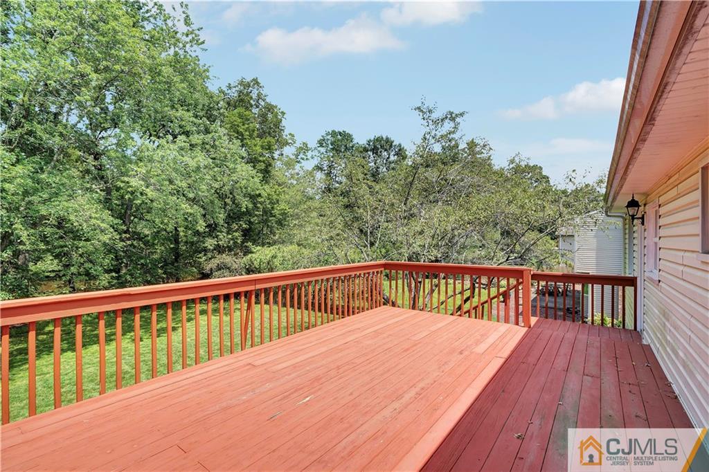 203 Riverbend Road Berkeley Heights, NJ 07922 - Photo 36 of 42 a view of balcony with wooden floor and fence