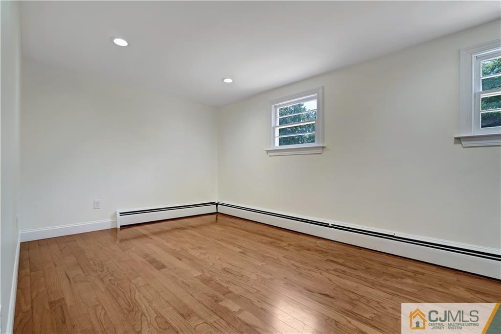 203 Riverbend Road Berkeley Heights, NJ 07922 - Photo 6 of 42 a view of an empty room with a window