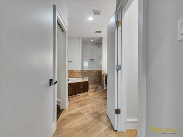 a bathroom with a sink and shower