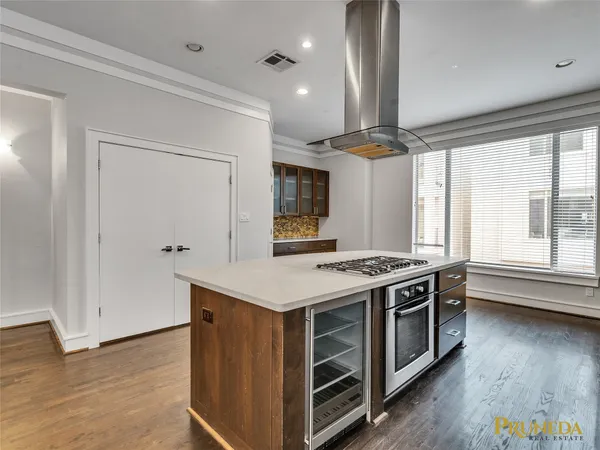 a kitchen with a stove and a refrigerator