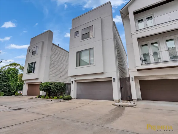 a front view of a house with garage