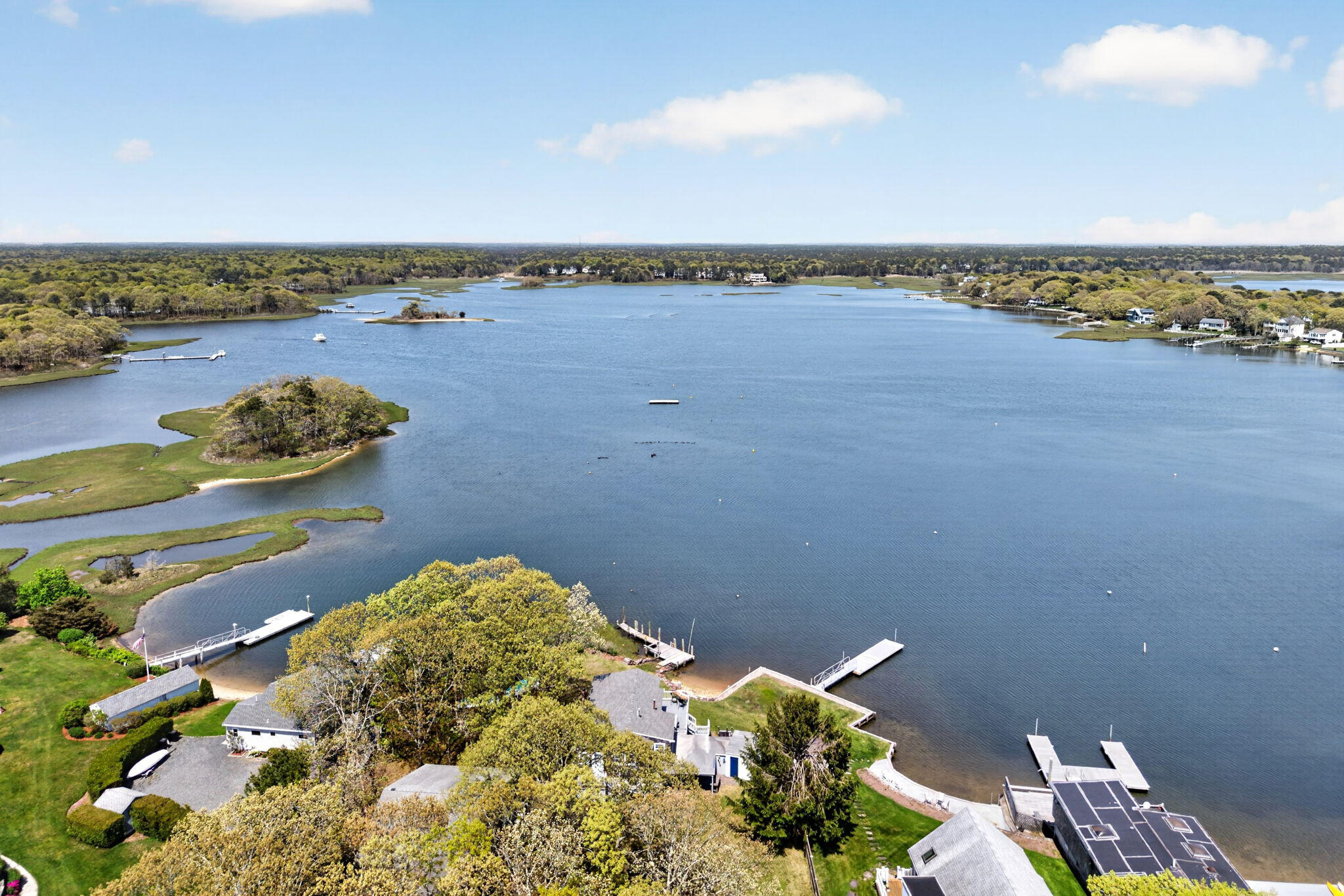 11 Clamshell Lane Mashpee, MA 02649 - Photo 29 of 43 a view of a lake with a nearby beach