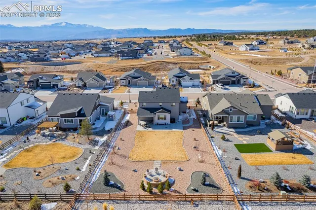 an aerial view of a swimming pool and mountain view