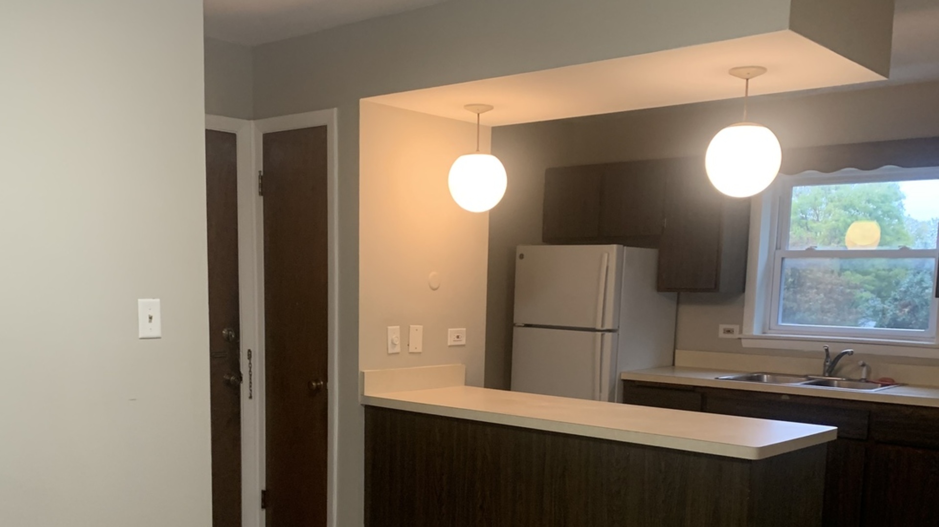 5631 6th Avenue, Unit 2D Countryside, IL 60525 - Photo 3 of 10 a kitchen with a sink and a refrigerator