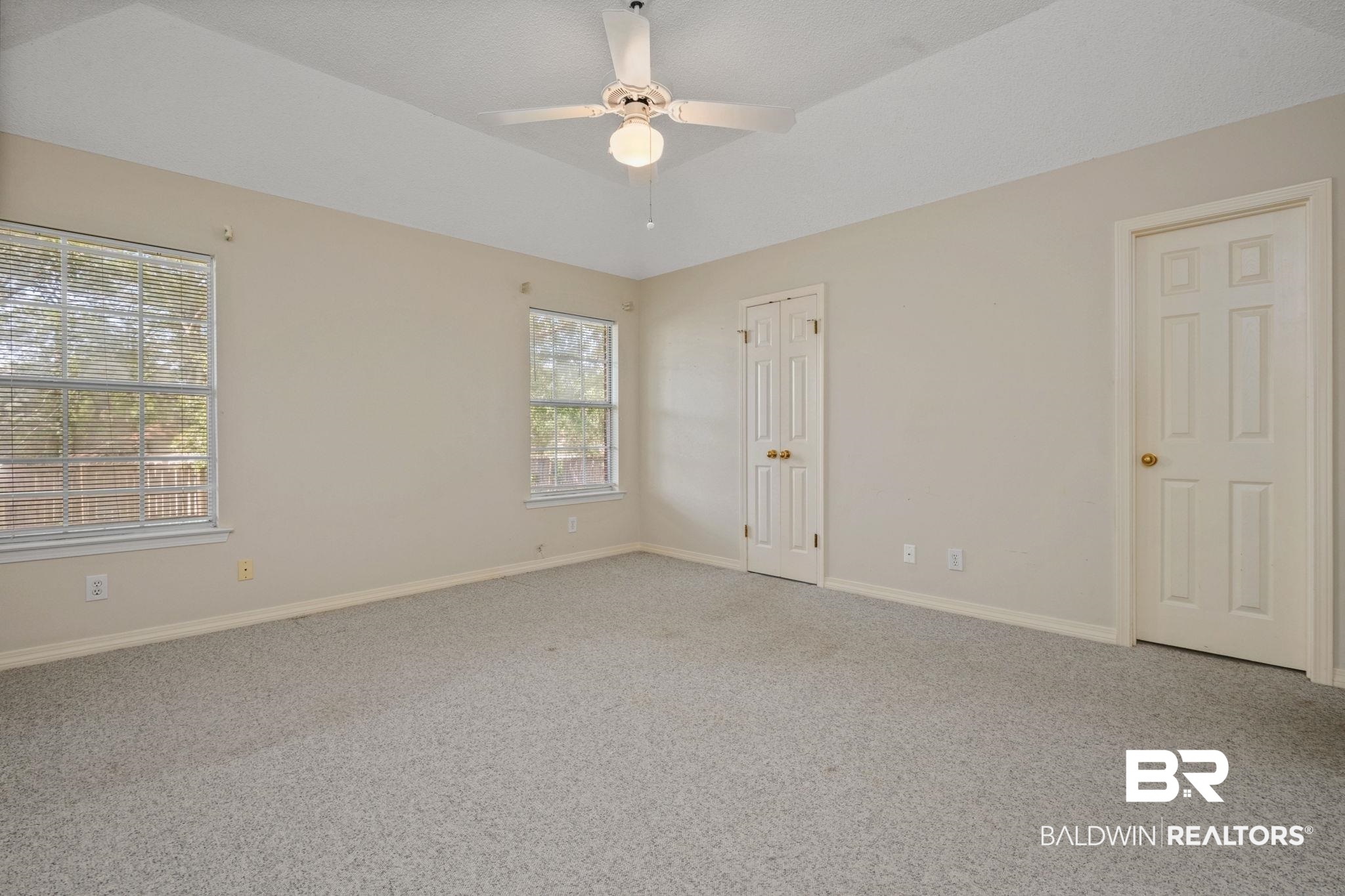 1340 Wellsley Court Mobile, AL 36695 - Photo 30 of 37 Unfurnished room with carpet flooring, a ceiling fan, and vaulted ceiling