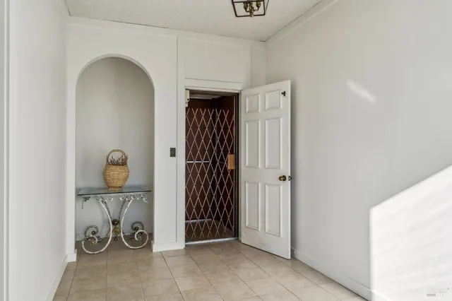 a view of an entryway with wooden floor