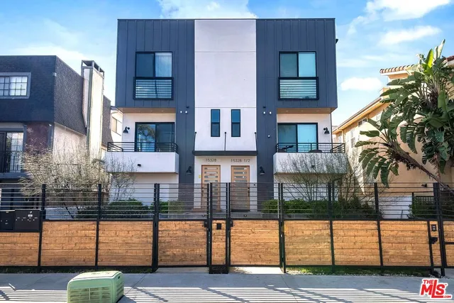 a view of front door and small yard