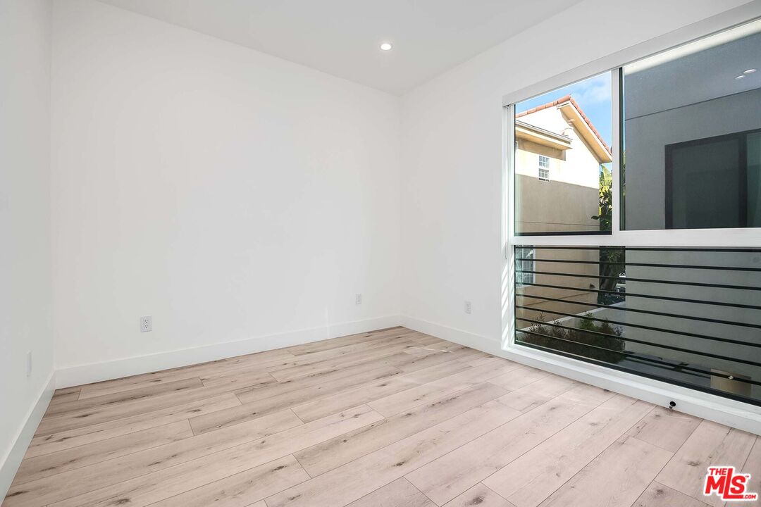 15330 Weddington Street Sherman Oaks, CA 91411 - Photo 12 of 30 a view of an empty room and wooden floor