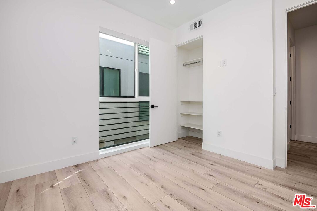 15330 Weddington Street Sherman Oaks, CA 91411 - Photo 13 of 30 a view of a livingroom with wooden floor