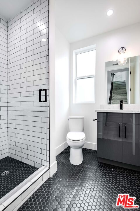 15330 Weddington Street Sherman Oaks, CA 91411 - Photo 14 of 30 a bathroom with a sink and a mirror