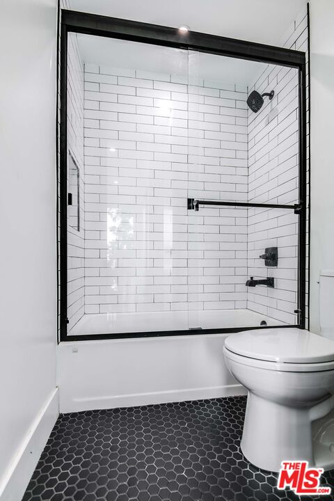 15330 Weddington Street Sherman Oaks, CA 91411 - Photo 20 of 30 a bathroom with a toilet and a shower